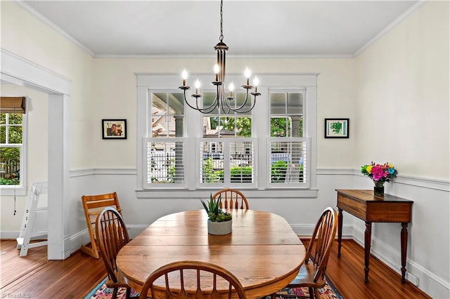 10 W Banner Ave, Winston-Salem, NC 27127 - dining space featuring wood finished floors, a chandelier, crown molding, and baseboards