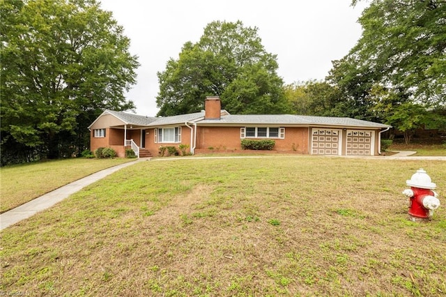 ranch-style house with a garage and a front lawn