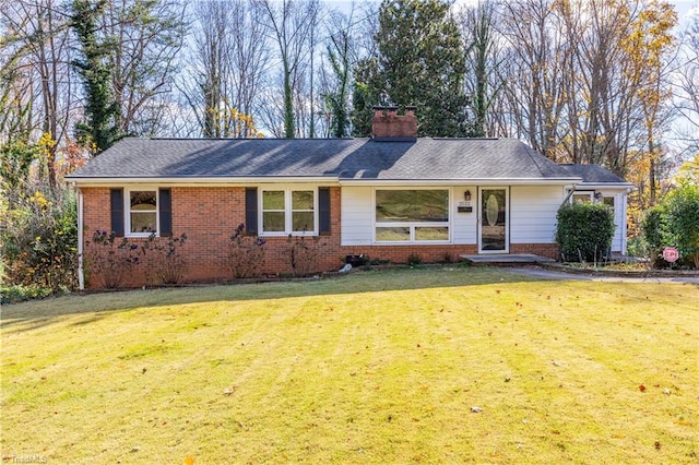 single story home with a front lawn