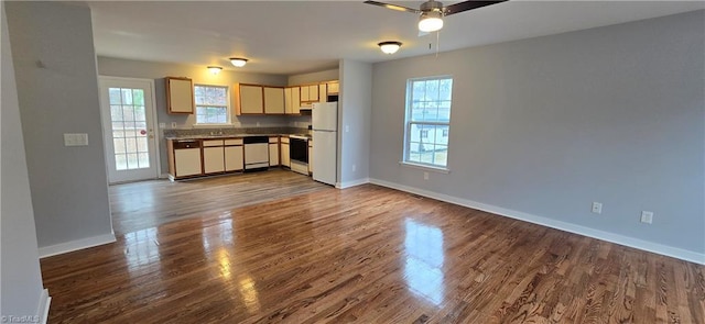 kitchen featuring dark hardwood / wood-style floors, ceiling fan, and appliances with stainless steel finishes