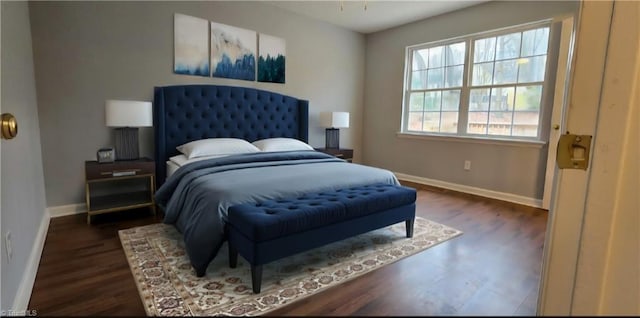 bedroom with dark wood-type flooring