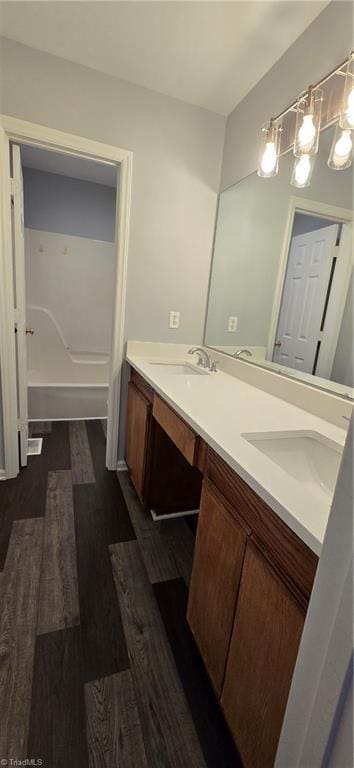 bathroom with vanity and hardwood / wood-style flooring