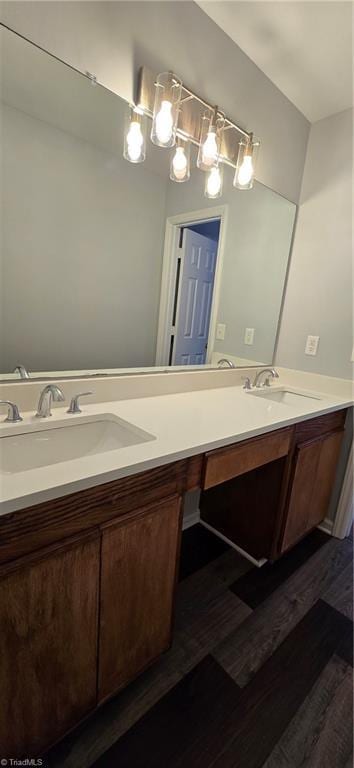 bathroom with hardwood / wood-style flooring and vanity