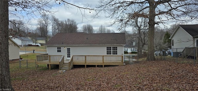 back of house with a wooden deck