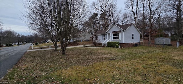 exterior space featuring a shed and a lawn