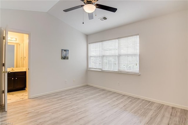 5430 Strasburg Dr, Greensboro, NC 27407 - spare room featuring light wood-style floors, ceiling fan, lofted ceiling, and baseboards