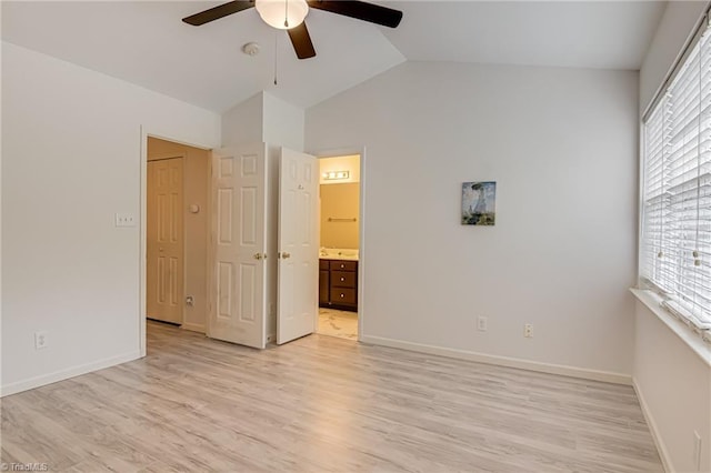 5430 Strasburg Dr, Greensboro, NC 27407 - unfurnished bedroom with multiple windows, light wood finished floors, lofted ceiling, and baseboards