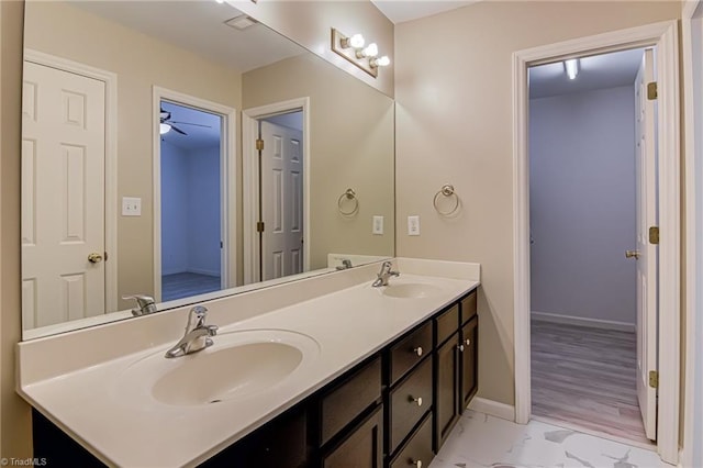 5430 Strasburg Dr, Greensboro, NC 27407 - bathroom featuring double vanity and baseboards