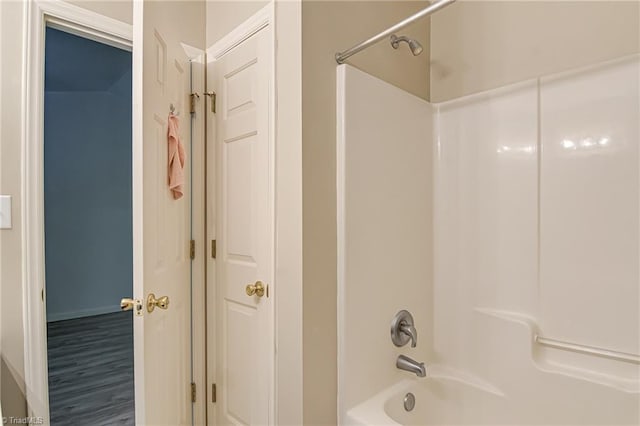 5430 Strasburg Dr, Greensboro, NC 27407 - bathroom featuring bathtub / shower combination and wood finished floors