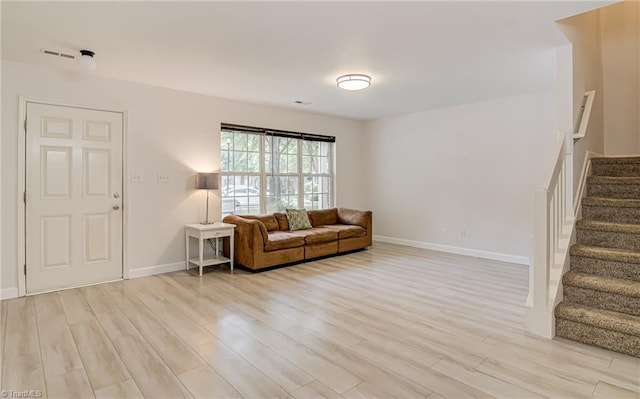 5430 Strasburg Dr, Greensboro, NC 27407 - living area with light wood-style flooring, stairs, and baseboards