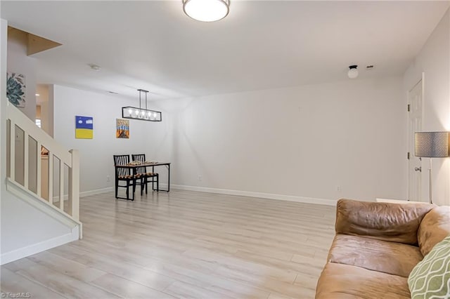 5430 Strasburg Dr, Greensboro, NC 27407 - living area with light wood finished floors, stairs, and baseboards
