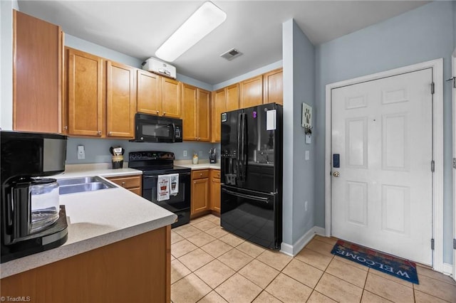1380 Heritage Pointe Dr Unit 310, Winston-Salem, NC 27127 - kitchen with black appliances, light tile patterned floors, and light countertops