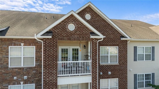 1380 Heritage Pointe Dr Unit 310, Winston-Salem, NC 27127 - view of front facade with brick siding and roof with shingles