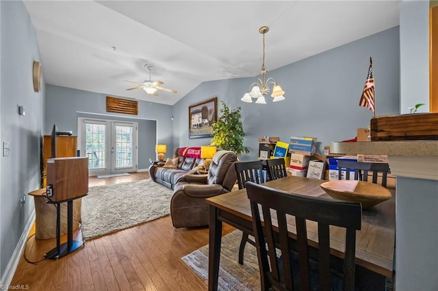 1380 Heritage Pointe Dr Unit 310, Winston-Salem, NC 27127 - dining space with hardwood / wood-style floors, french doors, lofted ceiling, a chandelier, and a ceiling fan