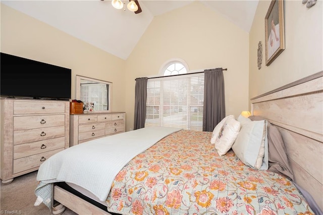 carpeted bedroom featuring vaulted ceiling and ceiling fan