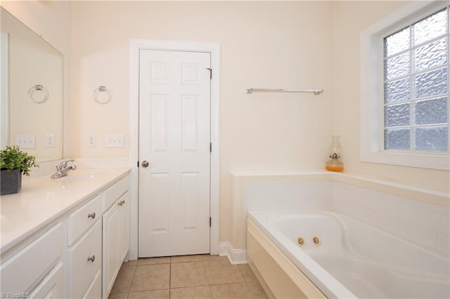 bathroom with vanity, tile patterned floors, and a bathtub