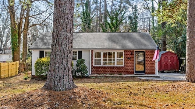 view of front facade with a storage shed