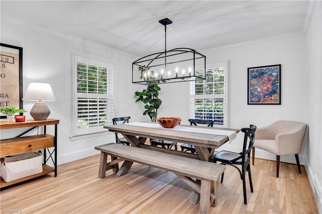 3480 York Rd, Winston-Salem, NC 27104 - dining space featuring plenty of natural light, crown molding, a chandelier, light wood finished floors, and baseboards