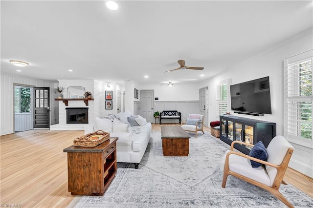 3480 York Rd, Winston-Salem, NC 27104 - living area with a fireplace, light wood-style floors, ornamental molding, recessed lighting, and a ceiling fan