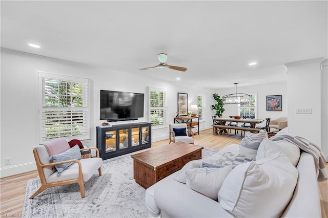 3480 York Rd, Winston-Salem, NC 27104 - living room featuring light wood-style flooring, recessed lighting, ceiling fan, baseboards, and a chandelier