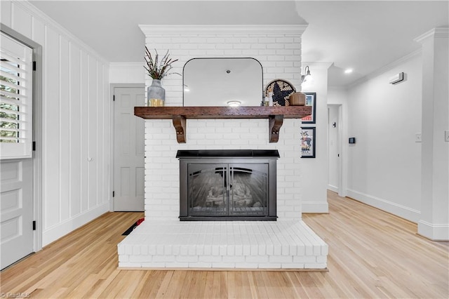 3480 York Rd, Winston-Salem, NC 27104 - detailed view of wood finished floors, crown molding, a fireplace, and baseboards