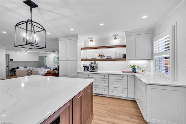 3480 York Rd, Winston-Salem, NC 27104 - kitchen with a chandelier, recessed lighting, light wood finished floors, white cabinetry, and tasteful backsplash