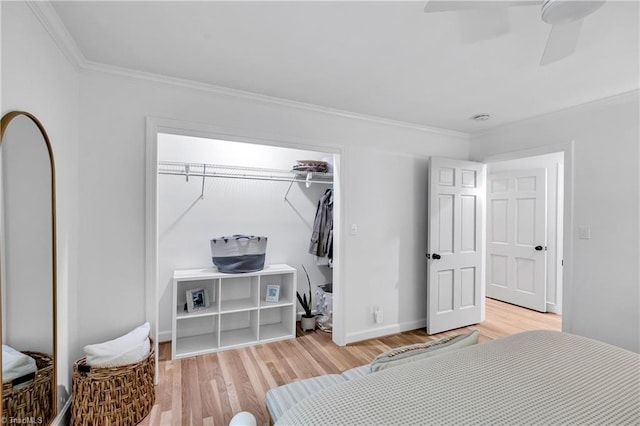 3480 York Rd, Winston-Salem, NC 27104 - bedroom featuring crown molding, light wood-style floors, a ceiling fan, baseboards, and a closet