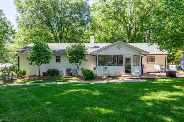 3480 York Rd, Winston-Salem, NC 27104 - rear view of property featuring a chimney, cooling unit, a sunroom, a patio, and roof with shingles