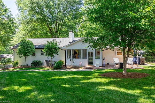 3480 York Rd, Winston-Salem, NC 27104 - back of property featuring a chimney and a sunroom