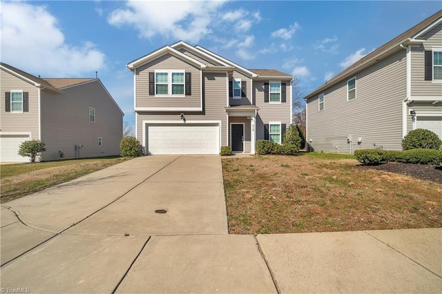 view of front of property with a garage and a front yard