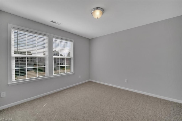 empty room featuring carpet flooring