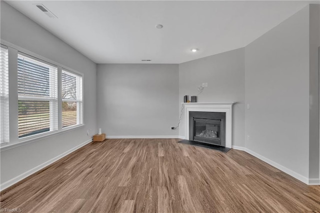 unfurnished living room featuring light hardwood / wood-style flooring