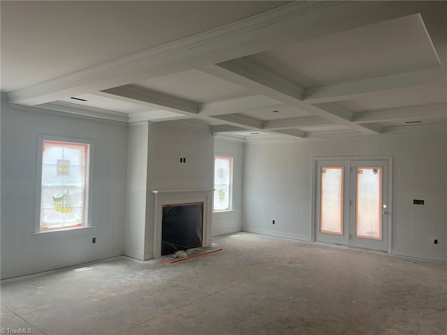 unfurnished living room with beamed ceiling and coffered ceiling