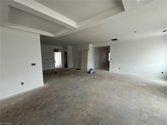 spare room featuring a raised ceiling