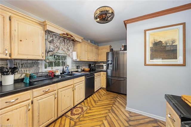 1973 Old Mountain Rd, Thomasville, NC 27360 - kitchen featuring appliances with stainless steel finishes, light brown cabinets, and decorative backsplash