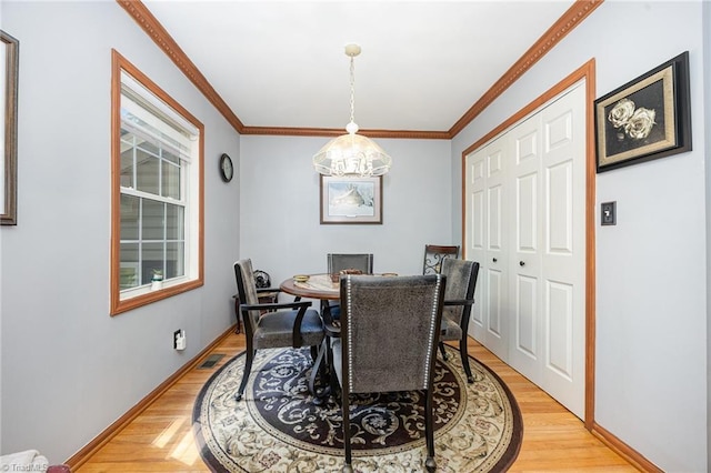 1973 Old Mountain Rd, Thomasville, NC 27360 - dining space with crown molding and light wood-type flooring