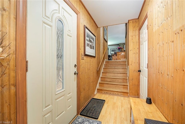 1973 Old Mountain Rd, Thomasville, NC 27360 - entryway with light wood finished floors, stairway, and wooden walls