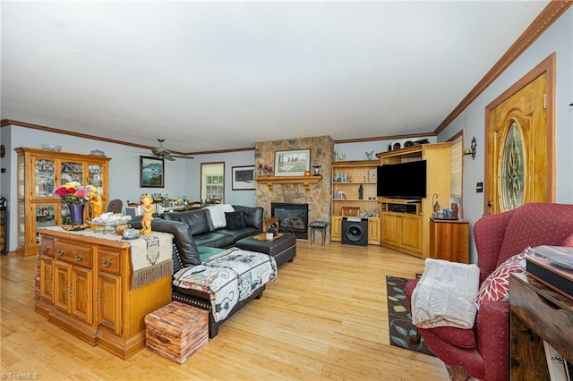 1973 Old Mountain Rd, Thomasville, NC 27360 - living room with crown molding, light wood-style flooring, a fireplace, and a ceiling fan