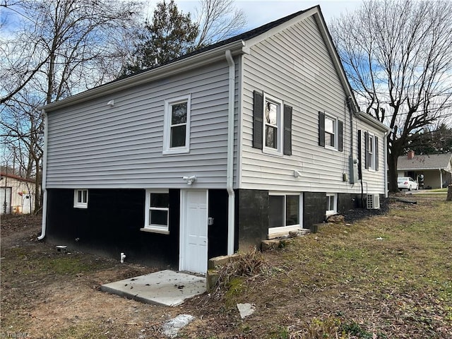 rear view of property with central air condition unit