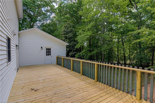 wooden deck with view of scattered trees