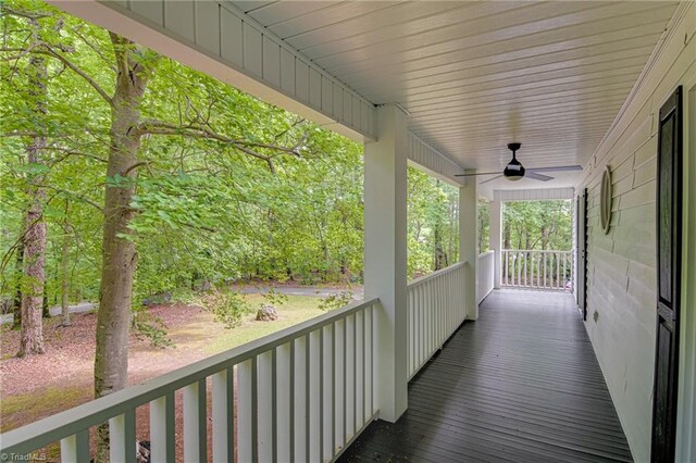 wooden deck with a ceiling fan and covered porch