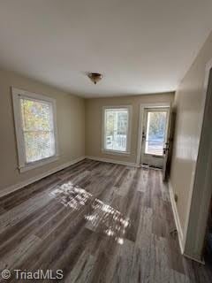 interior space with dark hardwood / wood-style floors