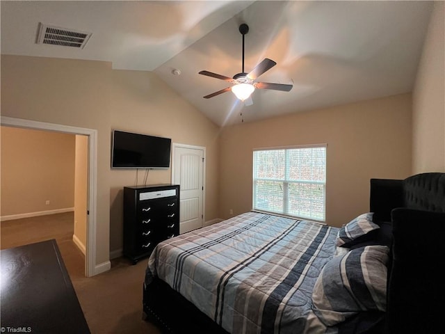 bedroom with ceiling fan, carpet floors, and lofted ceiling