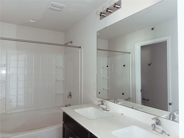 full bath featuring double vanity, a sink, and washtub / shower combination