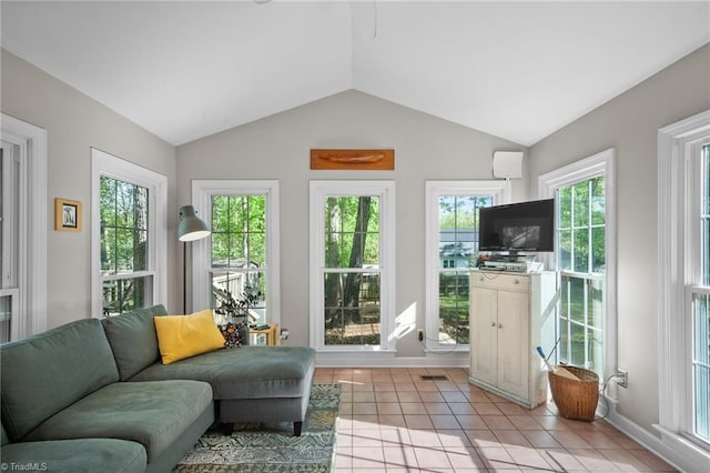4105 Waldenbrook Rd, Greensboro, NC 27407 - living area with vaulted ceiling, visible vents, baseboards, and light tile patterned floors