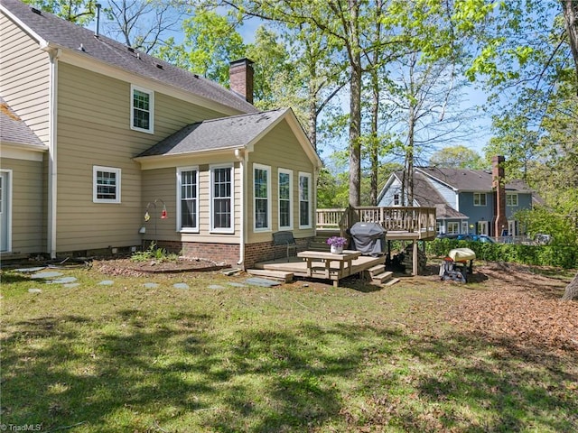 4105 Waldenbrook Rd, Greensboro, NC 27407 - rear view of house featuring a yard, roof with shingles, a chimney, and a deck