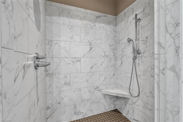 bathroom featuring tiled shower