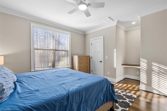 bedroom featuring ceiling fan, dark wood-type flooring, and ornamental molding