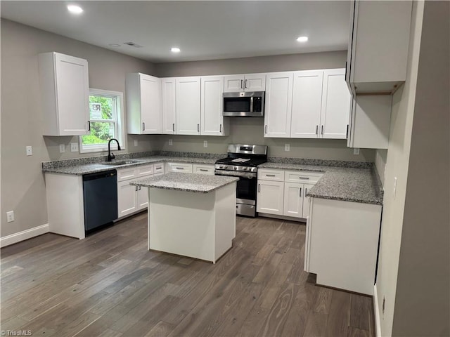3510 Meadow Glen Ct, Clemmons, NC 27012 - kitchen with light stone counters, dark wood finished floors, a sink, stainless steel appliances, and white cabinets
