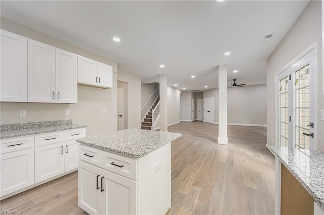 3510 Meadow Glen Ct, Clemmons, NC 27012 - kitchen featuring a ceiling fan, recessed lighting, light stone counters, white cabinetry, and light wood-type flooring
